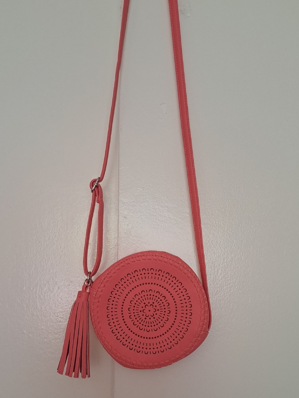 ART CLASS Coral Round Crossbody Bag with Tassel.